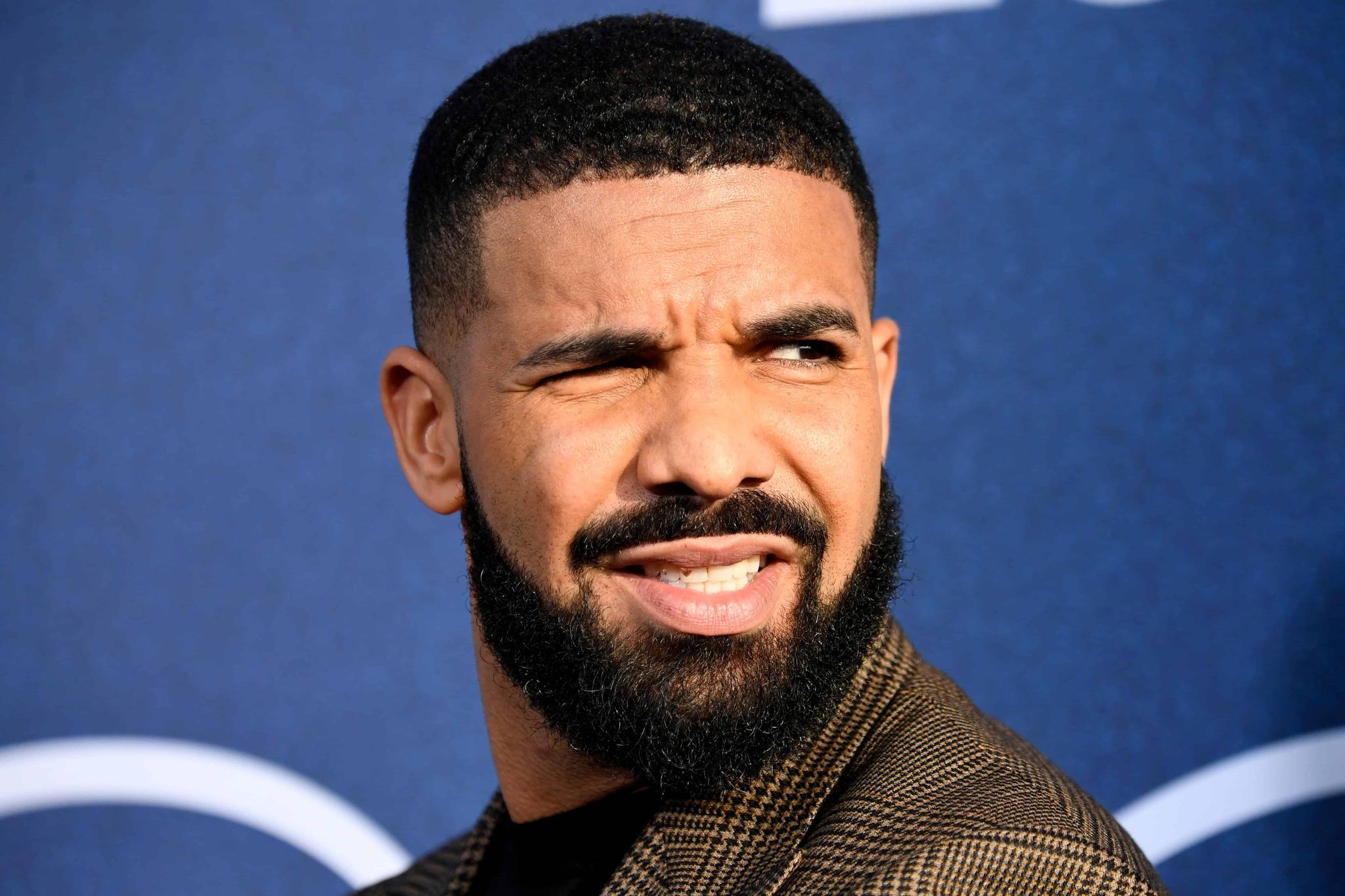 Artist Responsible For Drake's Dad's Drizzy Portrait Tattoo Slams The Rapper