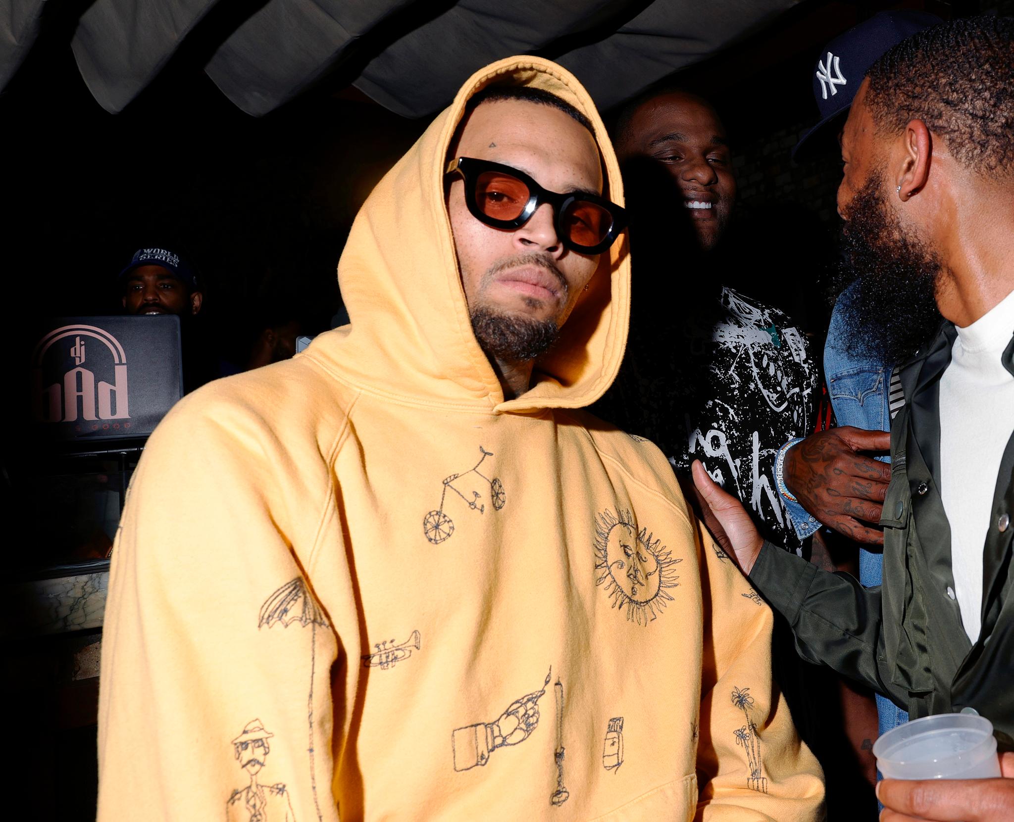 Chris Brown & Quavo Sit Next To Each Other At Paris Fashion Show; Brown Confirms Beef Still There